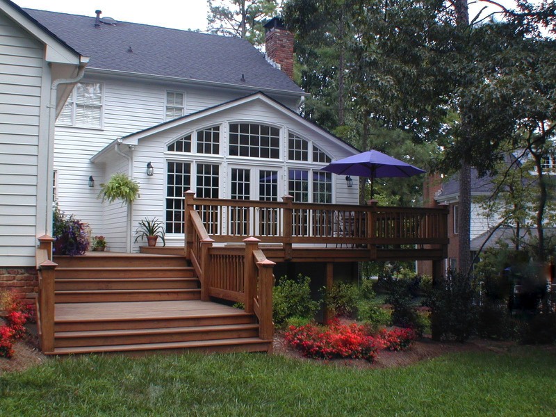 Add windows and French doors to improve flow onto deck